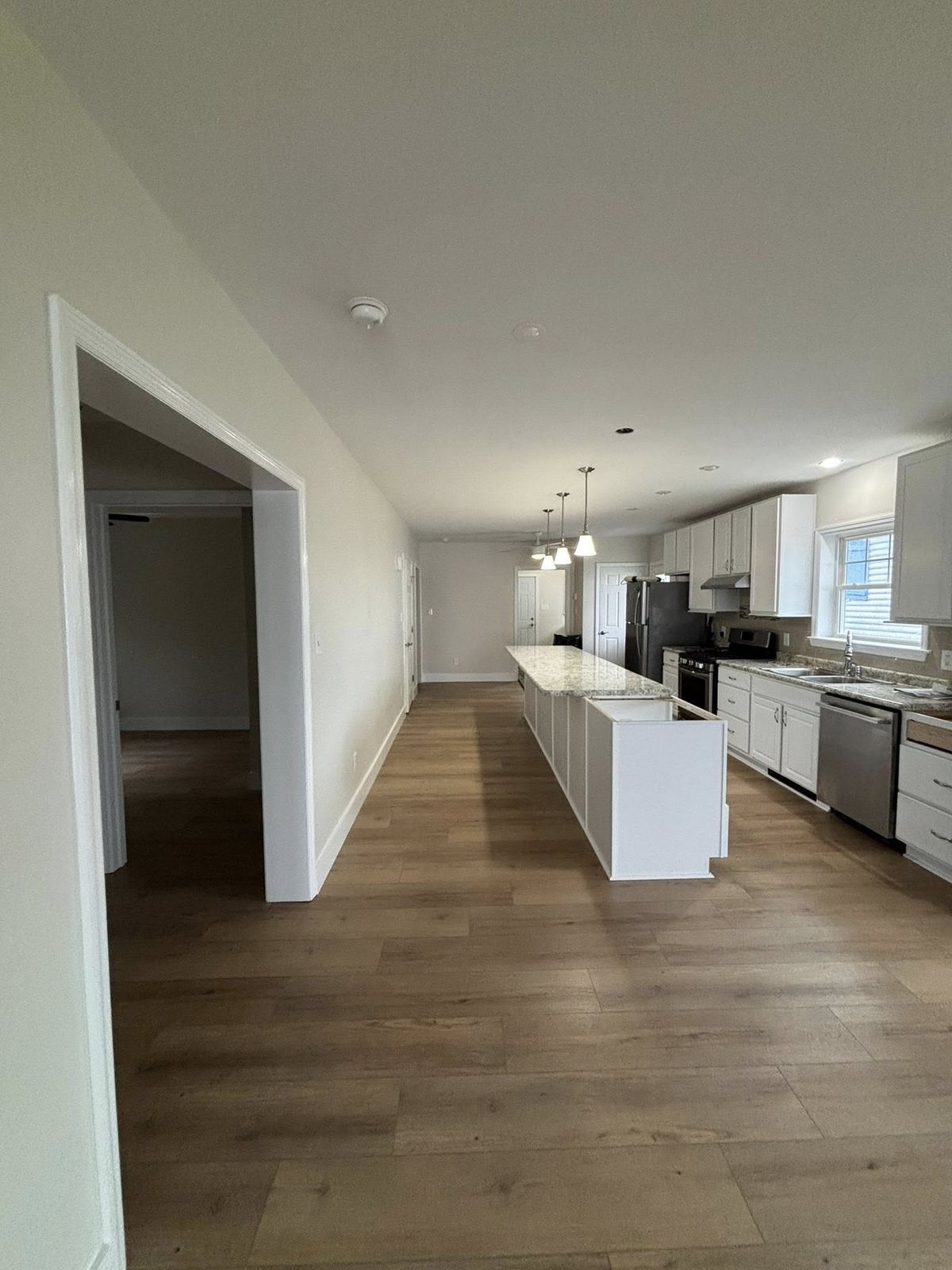 New construction kitchen with island and granite